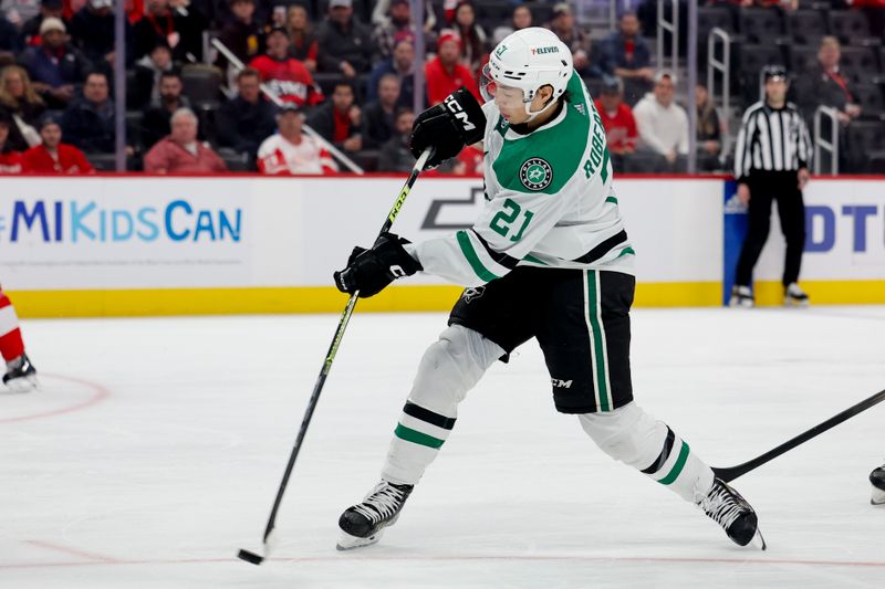 Jan 23, 2024; Detroit, Michigan, USA;  Dallas Stars left wing Jason Robertson (21) takes a shot in the third period against the Detroit Red Wings at Little Caesars Arena. Mandatory Credit: Rick Osentoski-USA TODAY Sports