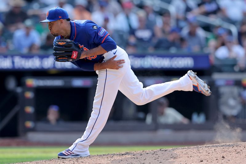 Aug 15, 2024; New York City, New York, USA; New York Mets relief pitcher Edwin Diaz (39) follows through on a pitch against the Oakland Athletics during the ninth inning at Citi Field. Mandatory Credit: Brad Penner-USA TODAY Sports