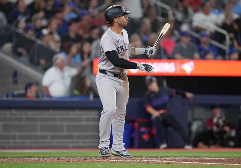 Jun 28, 2024; Toronto, Ontario, CAN; New York Yankees second base Gleyber Torres (25) reacts after hitting a home run against the Toronto Blue Jays during the sixth inning at Rogers Centre. Mandatory Credit: Nick Turchiaro-USA TODAY Sports