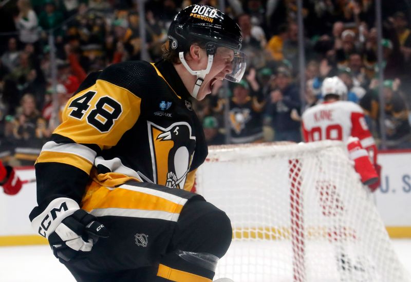 Mar 17, 2024; Pittsburgh, Pennsylvania, USA;  Pittsburgh Penguins right wing Valtteri Puustinen (48) reacts after scoring a goal against the Detroit Red Wings during the first period at PPG Paints Arena. Mandatory Credit: Charles LeClaire-USA TODAY Sports