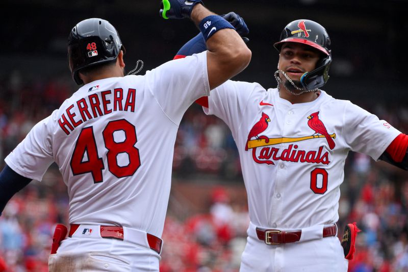 May 25, 2025; St. Louis, Missouri, USA;  St. Louis Cardinals shortstop Masyn Winn (0) is congratulated by designated hitter Ivan Herrera (48) after hitting a solo home run against the Arizona Diamondbacks during the third inning at Busch Stadium. Mandatory Credit: Jeff Curry-Imagn Images