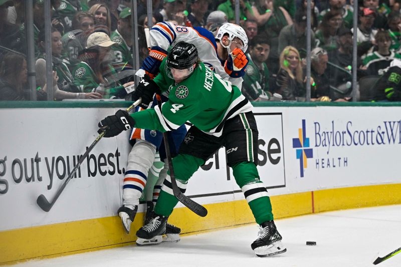 May 25, 2024; Dallas, Texas, USA; Dallas Stars defenseman Miro Heiskanen (4) checks Edmonton Oilers left wing Zach Hyman (18) during the first period in game two of the Western Conference Final of the 2024 Stanley Cup Playoffs at American Airlines Center. Mandatory Credit: Jerome Miron-USA TODAY Sports