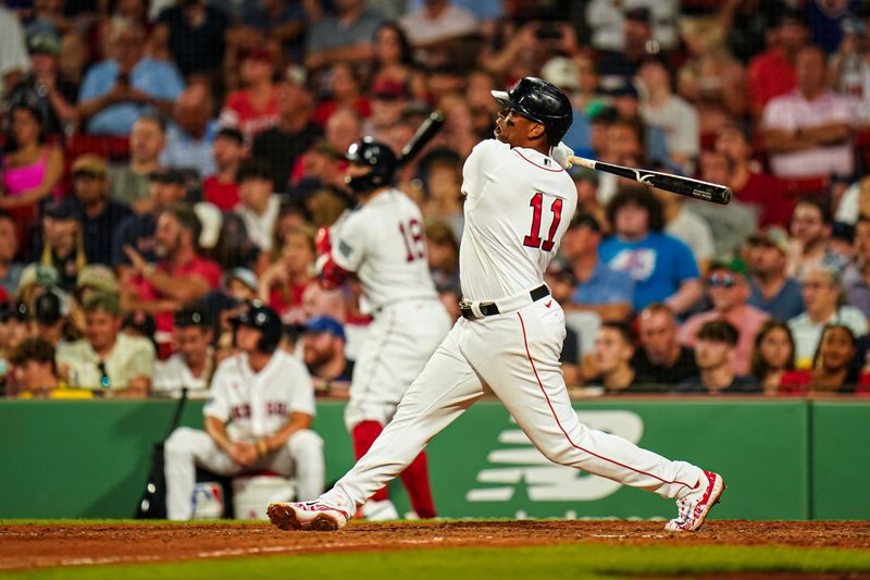 Jul 23, 2023; Boston, Massachusetts, USA; Boston Red Sox third baseman Rafael Devers (11) hits a home run against the New York Mets in the seventh inning at Fenway Park. Mandatory Credit: David Butler II-USA TODAY Sports