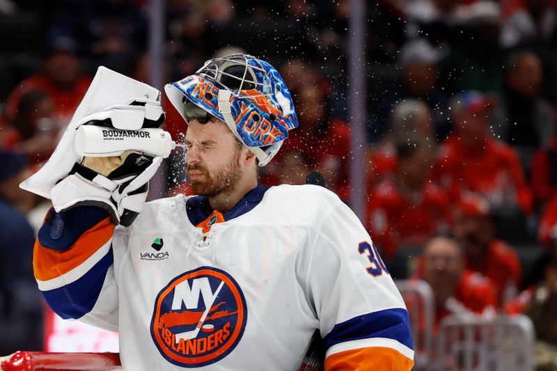 Oct 31, 2025; Washington, District of Columbia, USA; New York Islanders goaltender Ilya Sorokin (30) squirts his face with water during a timeout against the Washington Capitals during the third period at Capital One Arena. Mandatory Credit: Geoff Burke-Imagn Images