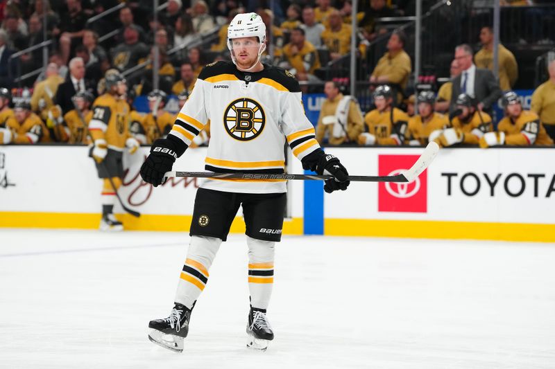 Mar 20, 2025; Las Vegas, Nevada, USA; Boston Bruins center Casey Mittelstadt (11) awaits a face off against the Vegas Golden Knights during the first period at T-Mobile Arena. Mandatory Credit: Stephen R. Sylvanie-Imagn Images
