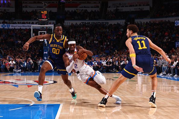 OKLAHOMA CITY, OK - DECEMBER 8: Shai Gilgeous-Alexander #2 of the Oklahoma City Thunder drives to the basket during the game against the Golden State Warriors on December 8, 2023 at Paycom Arena in Oklahoma City, Oklahoma. NOTE TO USER: User expressly acknowledges and agrees that, by downloading and or using this photograph, User is consenting to the terms and conditions of the Getty Images License Agreement. Mandatory Copyright Notice: Copyright 2023 NBAE (Photo by Zach Beeker/NBAE via Getty Images)