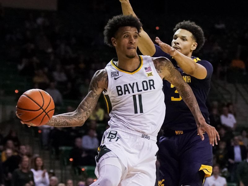 Feb 13, 2023; Waco, Texas, USA; Baylor Bears forward Jalen Bridges (11) passes the ball as West Virginia Mountaineers forward Tre Mitchell (3) defends during the second half at Ferrell Center. Mandatory Credit: Raymond Carlin III-USA TODAY Sports