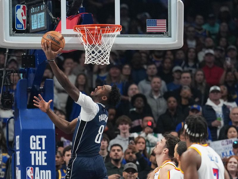 DALLAS, TX - FEBRUARY 12: Olivier Maxence-Prosper #8 of the Dallas Mavericks drives to the basket during the game against the Golden State Warriors on February 12, 2025 at American Airlines Center in Dallas, Texas. NOTE TO USER: User expressly acknowledges and agrees that, by downloading and or using this photograph, User is consenting to the terms and conditions of the Getty Images License Agreement. Mandatory Copyright Notice: Copyright 2025 NBAE (Photo by Glenn James/NBAE via Getty Images)