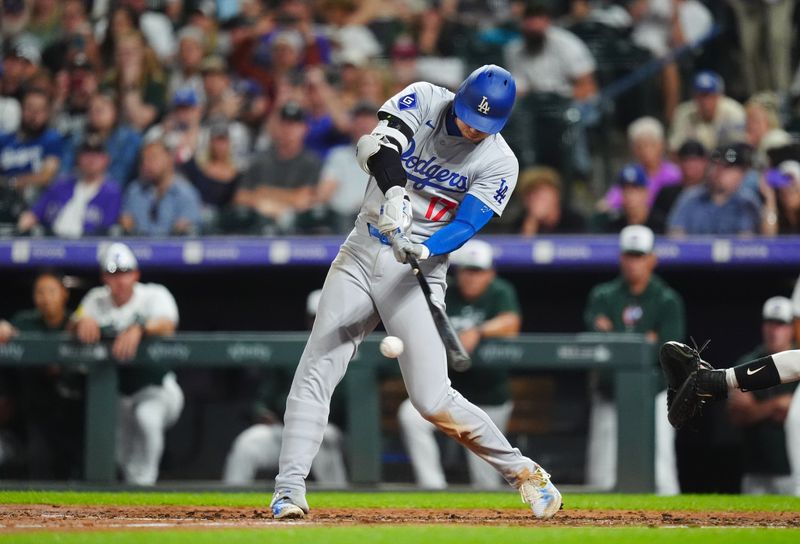 Sep 28, 2024; Denver, Colorado, USA; Los Angeles Dodgers designated hitter Shohei Ohtani (17) singles in the fifth inning against the Colorado Rockies at Coors Field. Mandatory Credit: Ron Chenoy-Imagn Images

