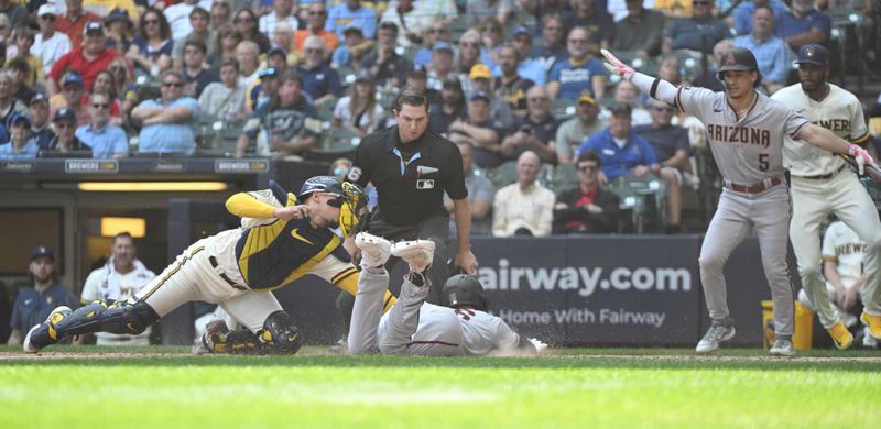 Jun 21, 2023; Milwaukee, Wisconsin, USA; Arizona Diamondbacks designated hitter Pavin Smith (26) slides in safely ahead of the tag by Milwaukee Brewers catcher William Contreras (24) in the sixth inning at American Family Field. Mandatory Credit: Michael McLoone-USA TODAY Sports