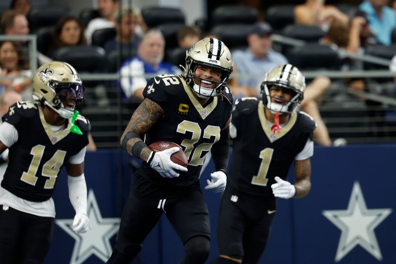 New Orleans Saints defensive back Tyrann Mathieu (32) celebrates after an interception during an NFL regular season game against the Dallas Cowboys on Sunday, September 15, 2024, in Arlington, Texas. (AP Photo/Matt Patterson)