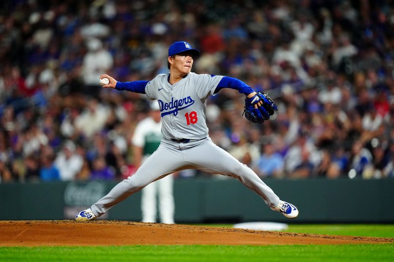 Sep 28, 2024; Denver, Colorado, USA; Los Angeles Dodgers starting pitcher Yoshinobu Yamamoto (18) delivers a pitch in the fifth inning against the Colorado Rockies at Coors Field. Mandatory Credit: Ron Chenoy-Imagn Images