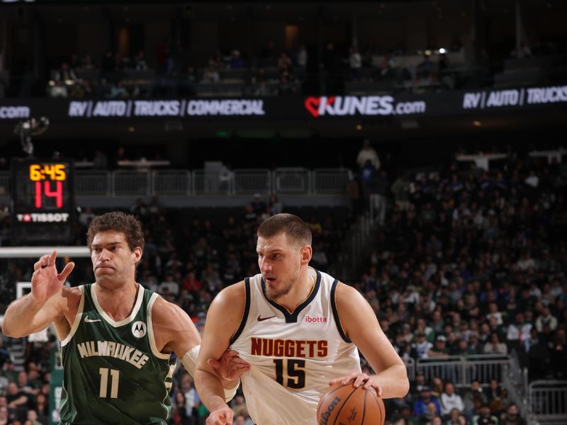 MILWAUKEE, WI - FEBRUARY 27: Nikola Jokic #15 of the Denver Nuggets drives to the basket during the game against the Milwaukee Bucks on February 27, 2025 at Fiserv Forum Center in Milwaukee, Wisconsin. NOTE TO USER: User expressly acknowledges and agrees that, by downloading and or using this Photograph, user is consenting to the terms and conditions of the Getty Images License Agreement. Mandatory Copyright Notice: Copyright 2025 NBAE (Photo by Gary Dineen/NBAE via Getty Images).