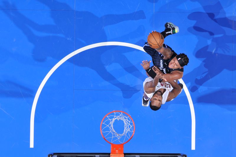 ORLANDO, FL - FEBRUARY 25:  Paolo Banchero #5 of the Orlando Magic drives to the basket during the game against the Cleveland Cavaliers on February 25, 2025 at Kia Center in Orlando, Florida. NOTE TO USER: User expressly acknowledges and agrees that, by downloading and or using this photograph, User is consenting to the terms and conditions of the Getty Images License Agreement. Mandatory Copyright Notice: Copyright 2025 NBAE (Photo by Fernando Medina/NBAE via Getty Images)