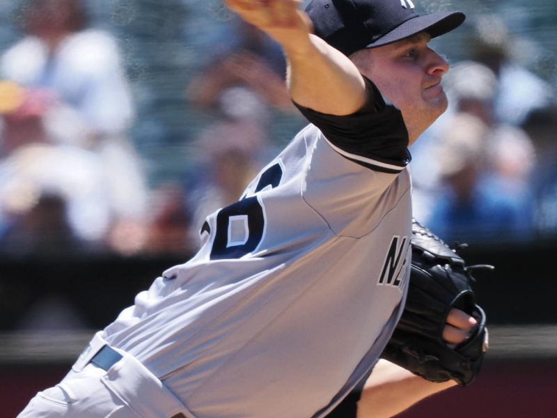 Jun 29, 2023; Oakland, California, USA; New York Yankees starting pitcher Clarke Schmidt (36) pitches the ball against the Oakland Athletics during the first inning at Oakland-Alameda County Coliseum. Mandatory Credit: Kelley L Cox-USA TODAY Sports