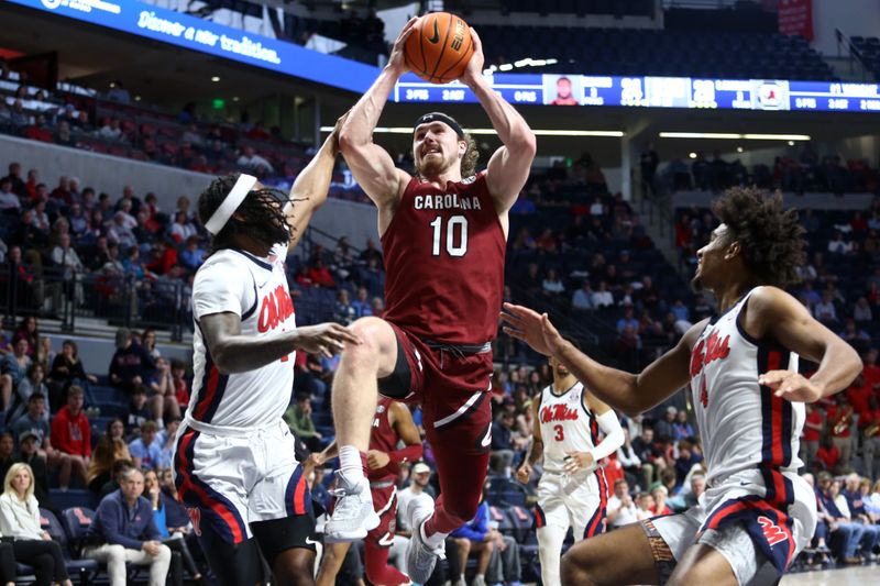 Feb 11, 2023; Oxford, Mississippi, USA; South Carolina Gamecocks forward Hayden Brown (10) drives to the basket as Mississippi Rebels guard Amaree Abram (1) defends during the first half at The Sandy and John Black Pavilion at Ole Miss. Mandatory Credit: Petre Thomas-USA TODAY Sports