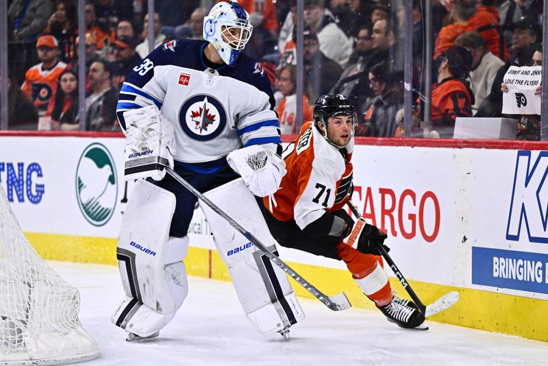 Feb 8, 2024; Philadelphia, Pennsylvania, USA; Philadelphia Flyers right wing Tyson Foerster (71) skates past Winnipeg Jets goalie Laurent Brossoit (39) in the third period at Wells Fargo Center. Mandatory Credit: Kyle Ross-USA TODAY Sports