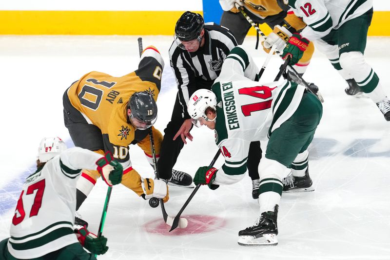 Apr 12, 2024; Las Vegas, Nevada, USA; Vegas Golden Knights center Nicolas Roy (10) takes a face off against Minnesota Wild center Joel Eriksson Ek (14) during the third period at T-Mobile Arena. Mandatory Credit: Stephen R. Sylvanie-USA TODAY Sports