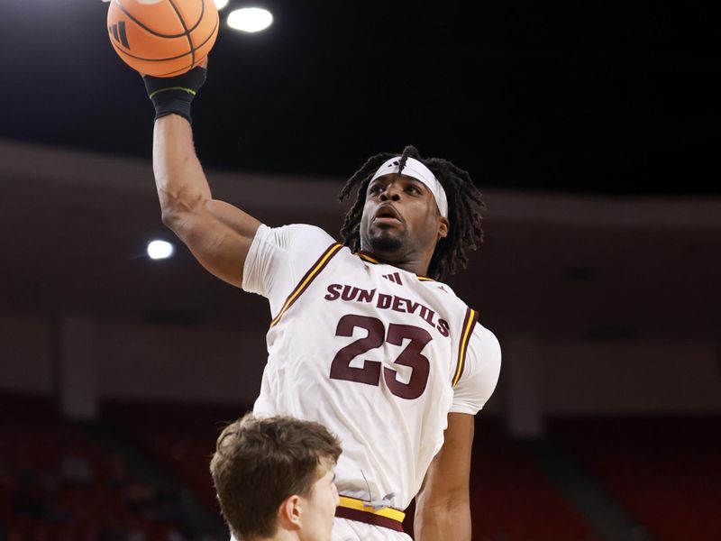 Jan 3, 2026; Tempe, Arizona, USA; Arizona State Sun Devils forward Allen Mukeba (23) slam dunks the ball over Colorado Buffaloes forward Sebastian Rancik (7) in the second half at Desert Financial Arena. Mandatory Credit: Mark J. Rebilas-Imagn Images