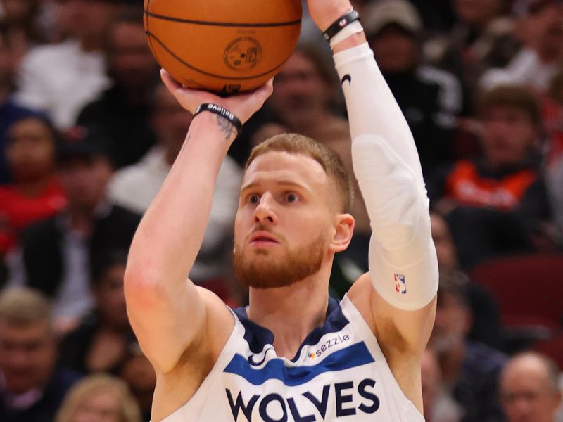 CHICAGO, ILLINOIS - NOVEMBER 07: Donte DiVincenzo #0 of the Minnesota Timberwolves shoots a three pointer against the Chicago Bulls during the second half at the United Center on November 07, 2024 in Chicago, Illinois. NOTE TO USER: User expressly acknowledges and agrees that, by downloading and or using this photograph, User is consenting to the terms and conditions of the Getty Images License Agreement.  (Photo by Michael Reaves/Getty Images)