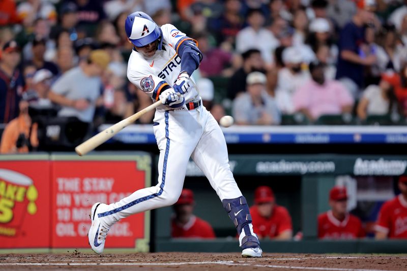 Apr 13, 2025; Houston, Texas, USA; Houston Astros right fielder Cam Smith (11) hits an RBI single against the Los Angeles Angels during the second inning at Daikin Park. Mandatory Credit: Erik Williams-Imagn Images