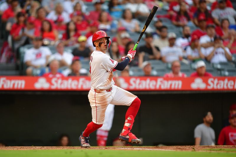 Jul 11, 2024; Anaheim, California, USA; Los Angeles Angels shortstop Zach Neto (9) hits a double against the Seattle Mariners during the second inning at Angel Stadium. Mandatory Credit: Gary A. Vasquez-USA TODAY Sports