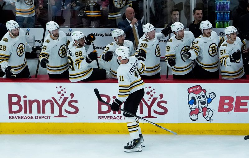 Oct 24, 2023; Chicago, Illinois, USA; Boston Bruins center Trent Frederic (11) celebrates his goal against the Chicago Blackhawks during the third period at United Center. Mandatory Credit: David Banks-USA TODAY Sports