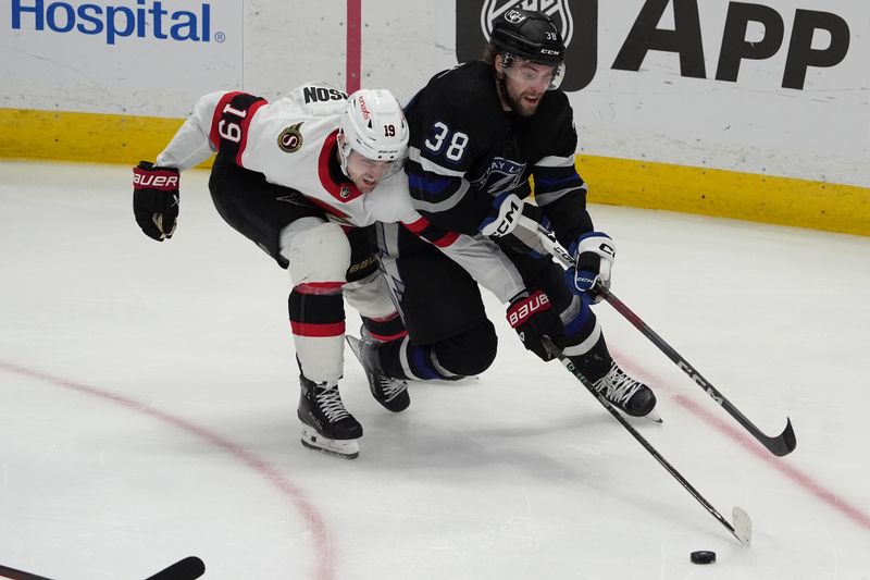 Feb 19, 2024; Tampa, Florida, USA; Ottawa Senators right wing Drake Batherson (19) battles for the puck with Tampa Bay Lightning left wing Brandon Hagel during the third period at Amalie Arena. Mandatory Credit: Dave Nelson-USA TODAY Sports