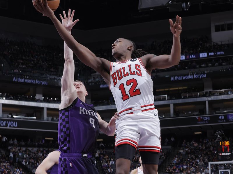 SACRAMENTO, CA - MARCH 4:  Ayo Dosunmu #12 of the Chicago Bulls drives to the basket during the game against the Sacramento Kings on March 4, 2024 at Golden 1 Center in Sacramento, California. NOTE TO USER: User expressly acknowledges and agrees that, by downloading and or using this Photograph, user is consenting to the terms and conditions of the Getty Images License Agreement. Mandatory Copyright Notice: Copyright 2024 NBAE (Photo by Rocky Widner/NBAE via Getty Images)