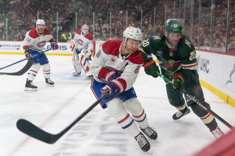 Dec 21, 2023; Saint Paul, Minnesota, USA; Montreal Canadiens defenseman Mike Matheson (8) and Minnesota Wild left wing Pat Maroon (20) play the puck in the corner in the first period at Xcel Energy Center. Mandatory Credit: Matt Blewett-USA TODAY Sports