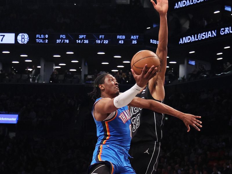 NEW YORK, NEW YORK - JANUARY 05:  Jalen Williams #8 of the Oklahoma City Thunder shoots against Nic Claxton #33 of the Brooklyn Nets  during their game at Barclays Center on January 05, 2024 in New York City.  User expressly acknowledges and agrees that, by downloading and or using this photograph, User is consenting to the terms and conditions of the Getty Images License Agreement.   (Photo by Al Bello/Getty Images)