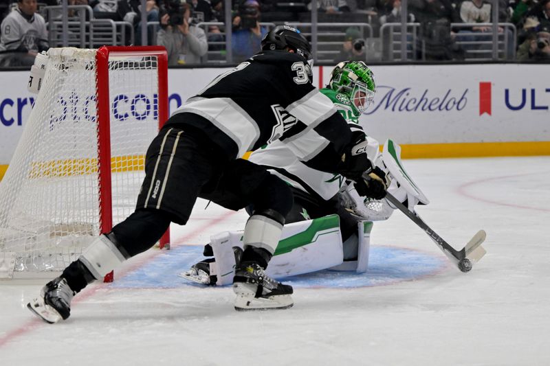 Jan 12, 2026; Los Angeles, California, USA;  Dallas Stars goaltender Jake Oettinger (29) defends Los Angeles Kings left wing Warren Foegele (37) as he tries to score in the second period at Crypto.com Arena. Mandatory Credit: Jayne Kamin-Oncea-Imagn Images