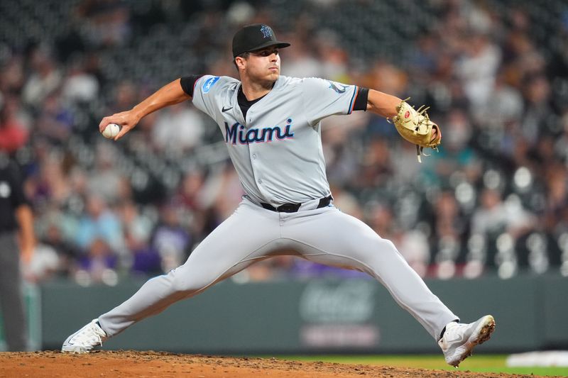 Aug 26, 2024; Denver, Colorado, USA; Miami Marlins relief pitcher John McMillon (66) delivers a pitch in the ninth inning against the Colorado Rockies at Coors Field. Mandatory Credit: Ron Chenoy-USA TODAY Sports