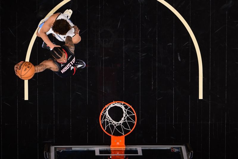 ATLANTA, GA - JANUARY 28: Jalen Green #4 of the Houston Rockets dunks the ball during the game against the Atlanta Hawks on January 28, 2025 at State Farm Arena in Atlanta, Georgia.  NOTE TO USER: User expressly acknowledges and agrees that, by downloading and/or using this Photograph, user is consenting to the terms and conditions of the Getty Images License Agreement. Mandatory Copyright Notice: Copyright 2025 NBAE (Photo by Adam Hagy/NBAE via Getty Images)