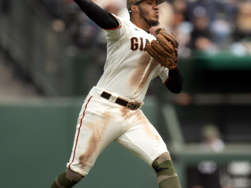 May 20, 2023; San Francisco, California, USA; San Francisco Giants second baseman Thairo Estrada (39) leaves his feet to throw out Miami Marlins left fielder Bryan De La Cruz at first base during the seventh inning at Oracle Park. Mandatory Credit: D. Ross Cameron-USA TODAY Sports