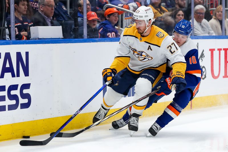 Apr 6, 2024; Elmont, New York, USA; Nashville Predators defenseman Ryan McDonagh (27) skates the puck past New York Islanders right wing Simon Holmstrom (10) during the second period at UBS Arena. Mandatory Credit: Tom Horak-USA TODAY Sports