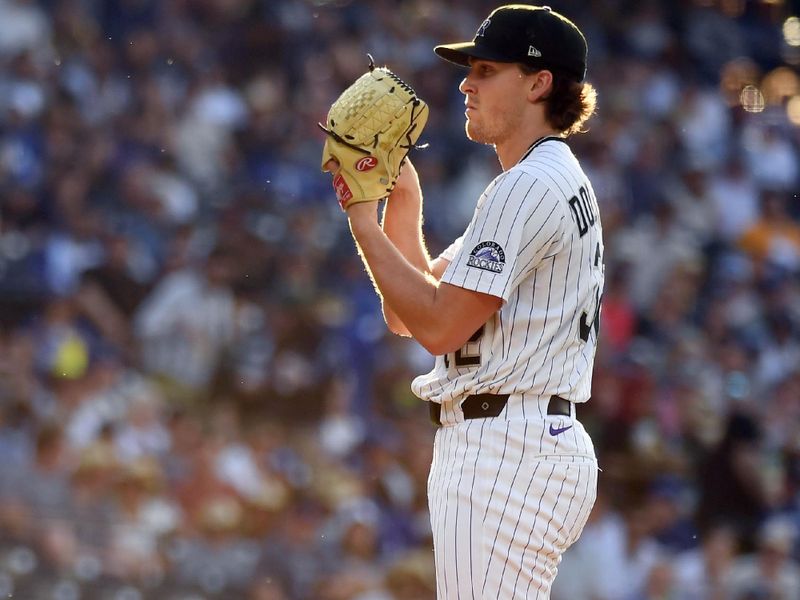 Jun 25, 2025; Denver, Colorado, USA; Colorado Rockies pitcher Chase Dollander (32) throws during the first inning against the Los Angeles Dodgers at Coors Field. Mandatory Credit: Christopher Hanewinckel-Imagn Images