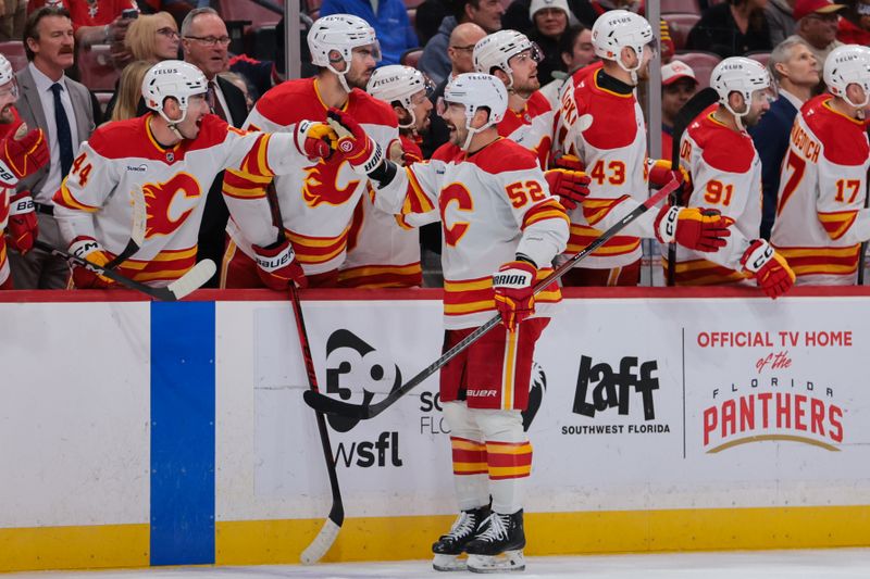 Nov 28, 2025; Sunrise, Florida, USA; Calgary Flames defenseman Mackenzie Weegar (52) celebrates with teammates after scoring against the Florida Panthers during the first period at Amerant Bank Arena. Mandatory Credit: Sam Navarro-Imagn Images Nov 28, 2025; Sunrise, Florida, USA; Calgary Flames defenseman Mackenzie Weegar (52) celebrates with teammates after scoring against the Florida Panthers during the first period at Amerant Bank Arena. Mandatory Credit: Sam Navarro-Imagn Images