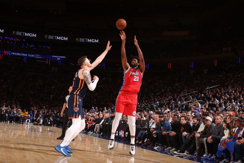 NEW YORK, NY - APRIL 22:  Joel Embiid #21 of the Philadelphia 76ers shoots a 3-point basket during the game  against Isaiah Hartenstein #55 of the New York Knicks during Round 1 Game 2 of the 2024 NBA Playoffs on April 22, 2024 at Madison Square Garden in New York City, New York.  NOTE TO USER: User expressly acknowledges and agrees that, by downloading and or using this photograph, User is consenting to the terms and conditions of the Getty Images License Agreement. Mandatory Copyright Notice: Copyright 2024 NBAE  (Photo by Nathaniel S. Butler/NBAE via Getty Images)