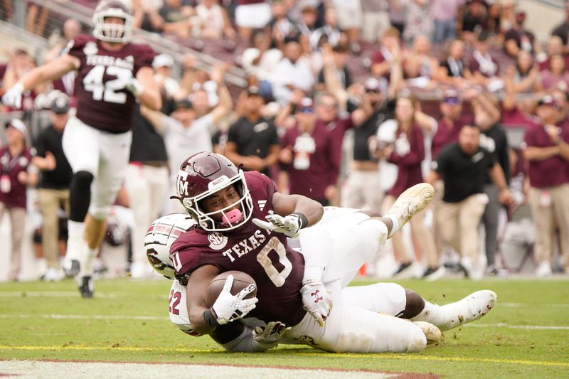 Oct 28, 2023; College Station, Texas, USA; Texas A&M Aggies wide receiver Ainias Smith (0) makes a touchdown against the South Carolina Gamecocks during the second quarter at Kyle Field. Mandatory Credit: Dustin Safranek-USA TODAY Sports