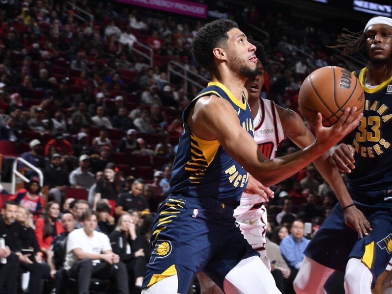 HOUSTON, TX - NOVEMBER 20:  Tyrese Haliburton #0 of the Indiana Pacers drives to the basket during the game against the Houston Rockets on November 20, 2024 at the Toyota Center in Houston, Texas. NOTE TO USER: User expressly acknowledges and agrees that, by downloading and or using this photograph, User is consenting to the terms and conditions of the Getty Images License Agreement. Mandatory Copyright Notice: Copyright 2024 NBAE (Photo by Logan Riely/NBAE via Getty Images)