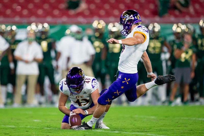 Oct 10, 2020; Tampa, Florida, USA; East Carolina Pirates place kicker Jake Verity (9) kicks an extra point during the first quarter of a game against the South Florida Bulls at Raymond James Stadium. Mandatory Credit: Mary Holt-USA TODAY Sports