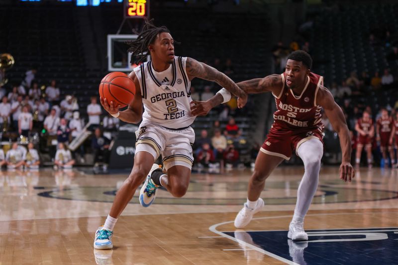 Jan 4, 2025; Atlanta, Georgia, USA; Georgia Tech Yellow Jackets guard Javian McCollum (2) drives past Boston College Eagles guard Fred Payne (5) in the second half at McCamish Pavilion. Mandatory Credit: Brett Davis-Imagn Images
