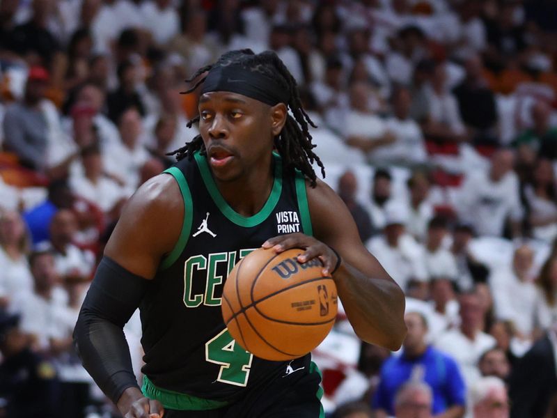 MIAMI, FLORIDA - APRIL 27: Jrue Holiday #4 of the Boston Celtics dribbles the ball against the Miami Heat during the first quarter in game three of the Eastern Conference First Round Playoffs at Kaseya Center on April 27, 2024 in Miami, Florida.  NOTE TO USER: User expressly acknowledges and agrees that, by downloading and or using this photograph, User is consenting to the terms and conditions of the Getty Images License Agreement. (Photo by Megan Briggs/Getty Images)