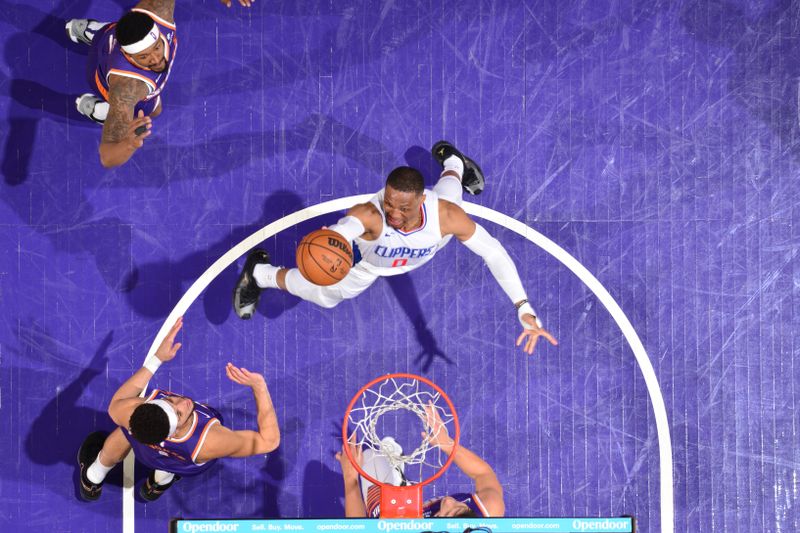 PHOENIX, AZ - APRIL 9:  Russell Westbrook #0 of the LA Clippers goes to the basket during the game on April 9, 2024 at Footprint Center in Phoenix, Arizona. NOTE TO USER: User expressly acknowledges and agrees that, by downloading and or using this photograph, user is consenting to the terms and conditions of the Getty Images License Agreement. Mandatory Copyright Notice: Copyright 2024 NBAE (Photo by Barry Gossage/NBAE via Getty Images)