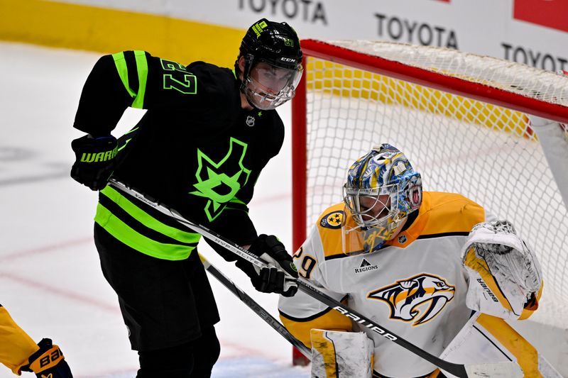 Apr 3, 2025; Dallas, Texas, USA; Dallas Stars left wing Mason Marchment (27) runs into Nashville Predators goaltender Justus Annunen (29) during the second period at the American Airlines Center. Mandatory Credit: Jerome Miron-Imagn Images