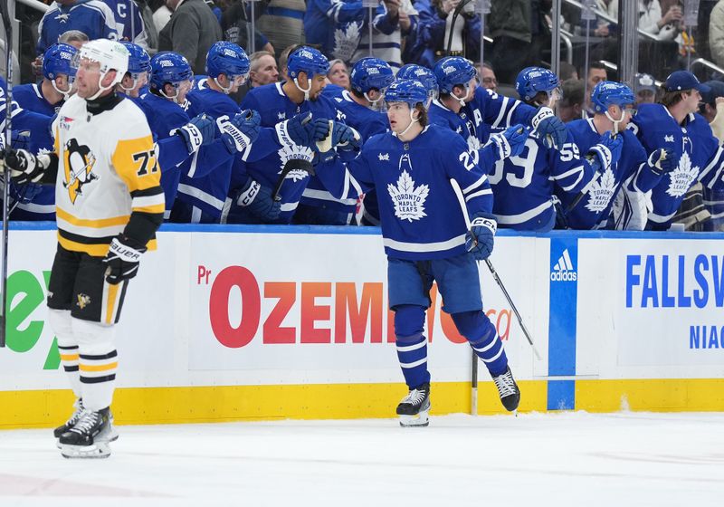 Apr 8, 2024; Toronto, Ontario, CAN; Toronto Maple Leafs left wing Matthew Knies (23) celebrates at the bench after scoring a goal against the Pittsburgh Penguins during the second period at Scotiabank Arena. Mandatory Credit: Nick Turchiaro-USA TODAY Sports