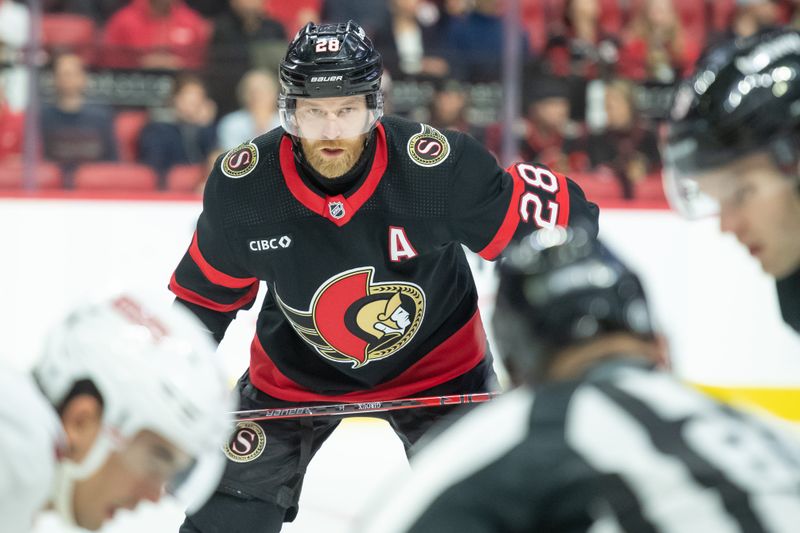 Dec 12, 2023; Ottawa, Ontario, CAN; Ottawa Senators right wing Claude Giroux (28) follows the puck on a face off in the first period against the Carolina Hurricanes at the Canadian Tire Centre. Mandatory Credit: Marc DesRosiers-USA TODAY Sports