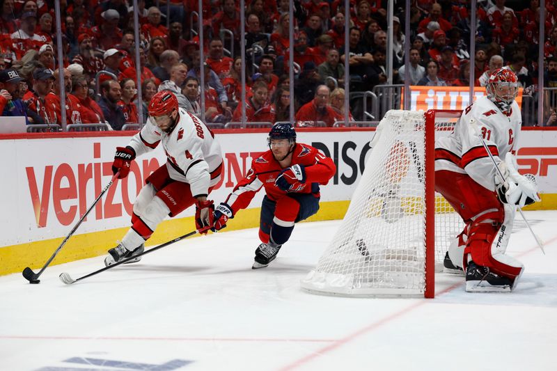 May 8, 2025; Washington, District of Columbia, USA; Carolina Hurricanes defenseman Shayne Gostisbehere (4) skates with the puck behind Hurricanes goaltender Frederik Andersen (31) as Washington Capitals left wing Anthony Beauvillier (72) chases in the third period in game two of the second round of the 2025 Stanley Cup Playoffs at Capital One Arena. Mandatory Credit: Geoff Burke-Imagn Images