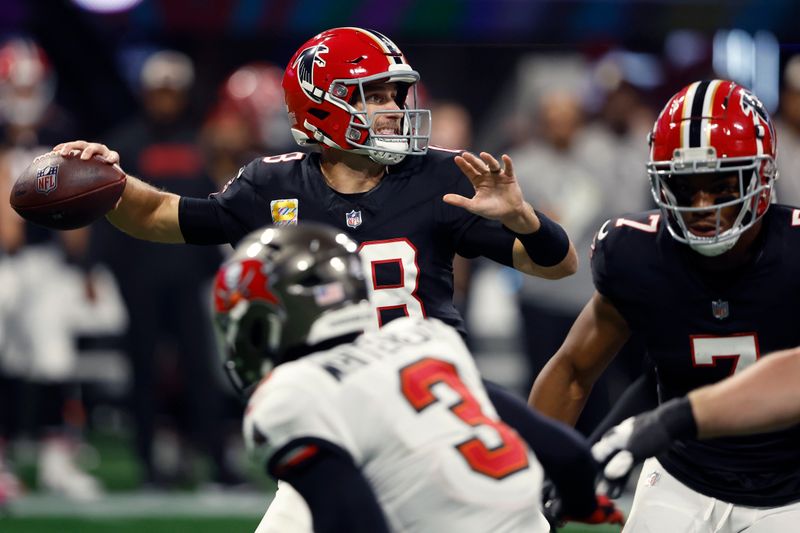 Atlanta Falcons quarterback Kirk Cousins throws a pass against the Tampa Bay Buccaneers during the first half of an NFL football game Thursday, Oct. 3, 2024, in Atlanta. (AP Photo/John Bazemore)